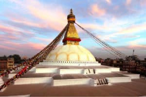 The most famous architecture in Kathmandu for your Nepal family trip. Boudhanath stupa has Buddha's eyes and eyebrows painted on. Between them, the numeral one is painted in the fashion of a nose.