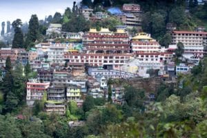 The late-17th-century Buddhist Sanga Choling Monastery in Darjeeling has breathtaking mountain views. A must-see in East India Tours.