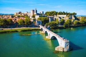 Visit the legendary Pont Saint-Bénézet arches over the Rhône River, ending dramatically halfway across during your Avignon tour