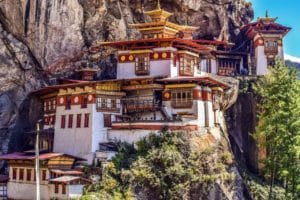 Taktshang Monastery is also known as the Tiger’s Nest. It clings to a cliff on the side of a Himalayan mountain. A must see in Bhutan tourist attractions.