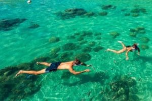 Snorkeling over reef in turquoise water